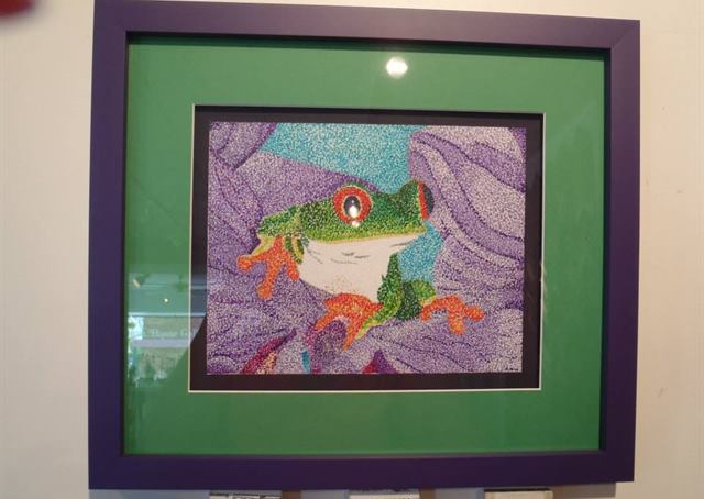 Custom framed artwork by Frame House Gallery