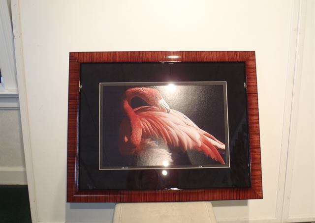 Framed work on display in the window
