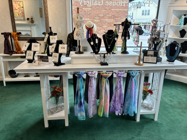 Gift shop display of scarves and jewelry