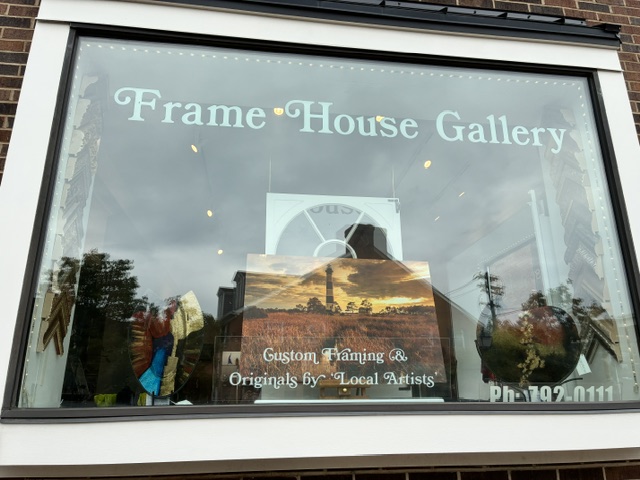 The Frame House Gallery storefront window in Old Montgomery, Cincinnati, lettered with the gallery name