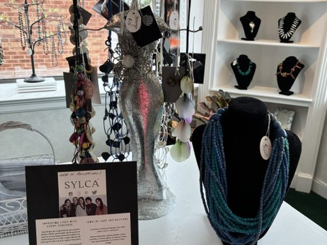 SYLCA necklaces and a multi-strand beaded collar on display