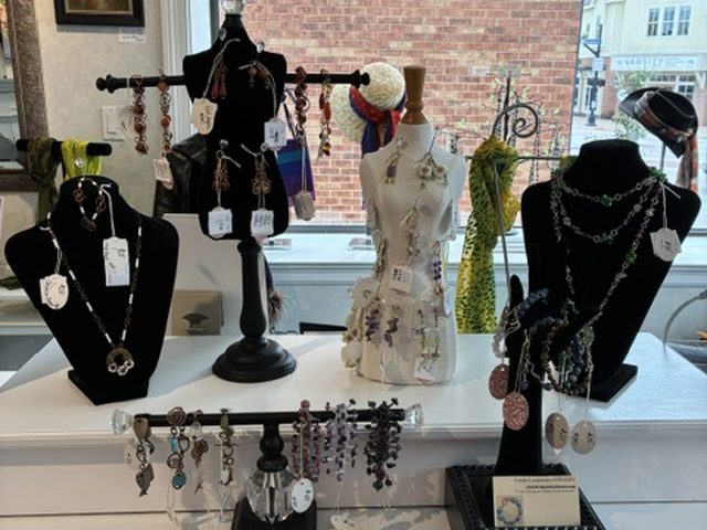 Necklaces, earrings and bracelets on display stands in the front window